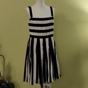 Black and white striped dress with pleated bottom